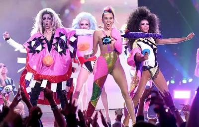Everything about Miley Cyrus' technicolor finale performance at the 2015 Video Music Awards was a total jaw-dropper. From the colorful costumes to her backup dancers, it was one of the biggest surprises of the night.