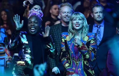 Taylor Swift enjoys the show with her collaborator Todrick Hall at the 2019 VMAs.