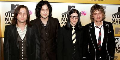 Jack White takes a break from red and white as he joins fellow black-clad Raconteurs Patrick Keeler, Little Jack Lawrence and Brendan Benson at the 2006 VMAs.