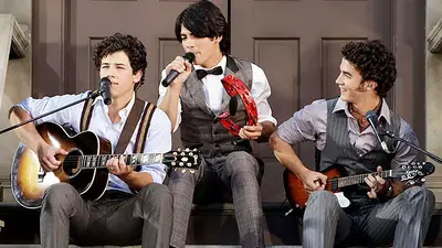 Jonas Brothers perform "Lovebug" on a sidewalk set at the 2008 MTV Video Music Awards in Hollywood.