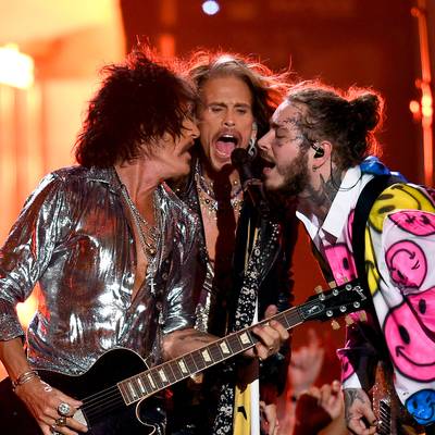 Post Malone rocks out with Steven Tyler and Joe Perry of Aerosmith.