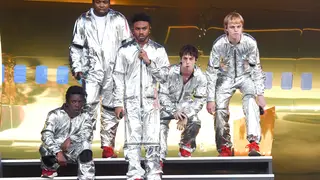 Brockhampton perform in silvery bodysuits at the 2019 Governors Ball Music Festival