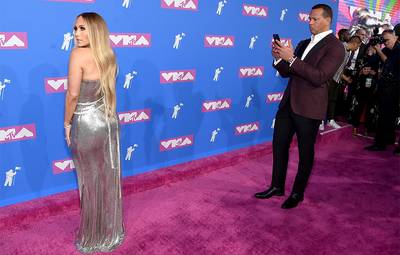 Baseball superstar Alex Rodriguez loved his girlfriend Jennifer Lopez’s look so much he snapped a photo for himself on the 2018 Video Music Awards Red Carpet.