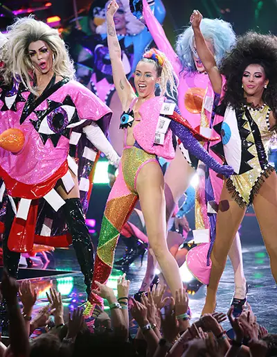 Miley Cyrus' technicolored hosting gig at the 2015 MTV Video Music Awards was as off-the-walls as expected thanks to totally crazy outfits and one insane surprise finale performance that no one could stop talking about. (Getty Images)