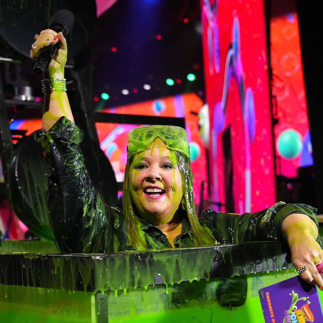 Melissa McCarthy takes a Slimey dip on stage at the Kids' Choice Awards 2023, thanks to her Little Mermaid co-stars Halle Bailey & Awkwafina!