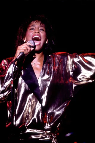 Whitney Houston - With the release of her self-titled debut album in 1985, there was no looking back for Whitney. Early hits such as "Saving All My Love for You" and "How Will I Know" made her an overnight superstar.&nbsp;(Photo: Paul Natkin/WireImage)