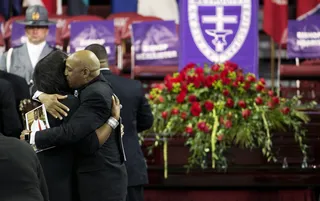 A Tribute to Rev. Pinckney - Mourners embrace next to the casket of Sen. Clementa Pinckney&nbsp;before his funeral service.&nbsp;(Photo: AP Photo/David Goldman)