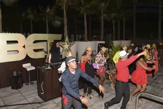 In Step - There’s nothing better than a group dance to set the mood. IFÉ-ILÉ had all the right steps to keep guests on their toes!(Photo: Gustavo Caballero/Getty Images for BET)