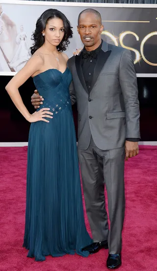 Jamie Foxx and Daughter - Jamie Foxx opted to bring his 19-year-old daughter as his date. Daughter Corinne went for a strapless lattice bodice with a flowing bottom and Jamie added a little sparkle to his Calvin Klein suit with a sparkly bow tie.   (Photo: Jason Merritt/Getty Images)