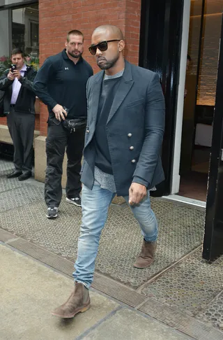 Give Me 50 Feet - Kanye West looks annoyed by the awaiting paparazzi outside his Soho apartment in NYC.&nbsp;(Photo: TNYF/WENN.com)