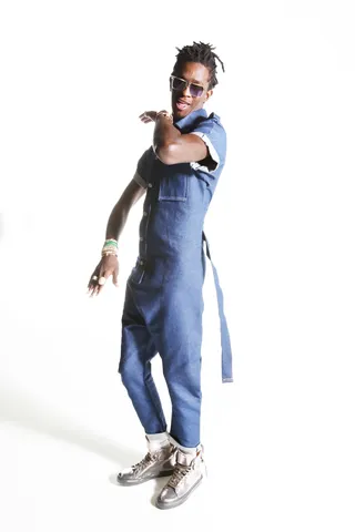 Denim jumpsuit by ElevexII; metallic high top sneakers by Buscemi - (Photo: Krista Schlueter)