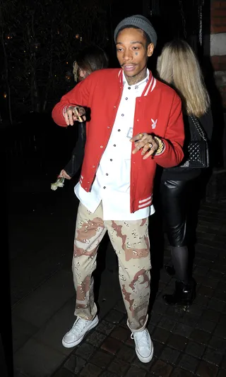 Feeling Fancy Free - A newly single&nbsp;Wiz Khalifa&nbsp;does a little two-step as he leaves the Tom Ford Fragrance Launch Party during London Collections Men A/W 2015 fashion week at the Chiltern Firehouse in London.(Photo: Splash News)