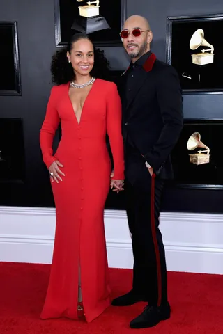 Alicia Keys and Swizz Beats&nbsp; - Alicia looks beautiful in a red deep v-neck gown and swizz looks complimented her very well in a black and red tux. (Photo: Amy Sussman/FilmMagic)