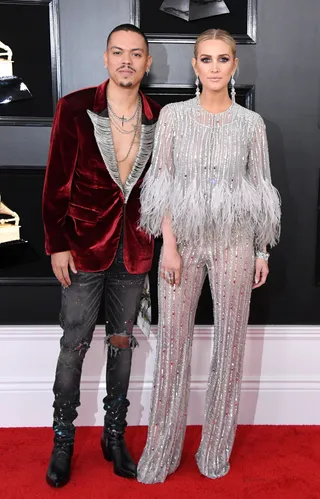 Evan and Ashlee Ross - The couple is gorg. Evn in burgundy velvet and Ashlee in A silver beaded and feather look. (Photo: Jon Kopaloff/Getty Images)