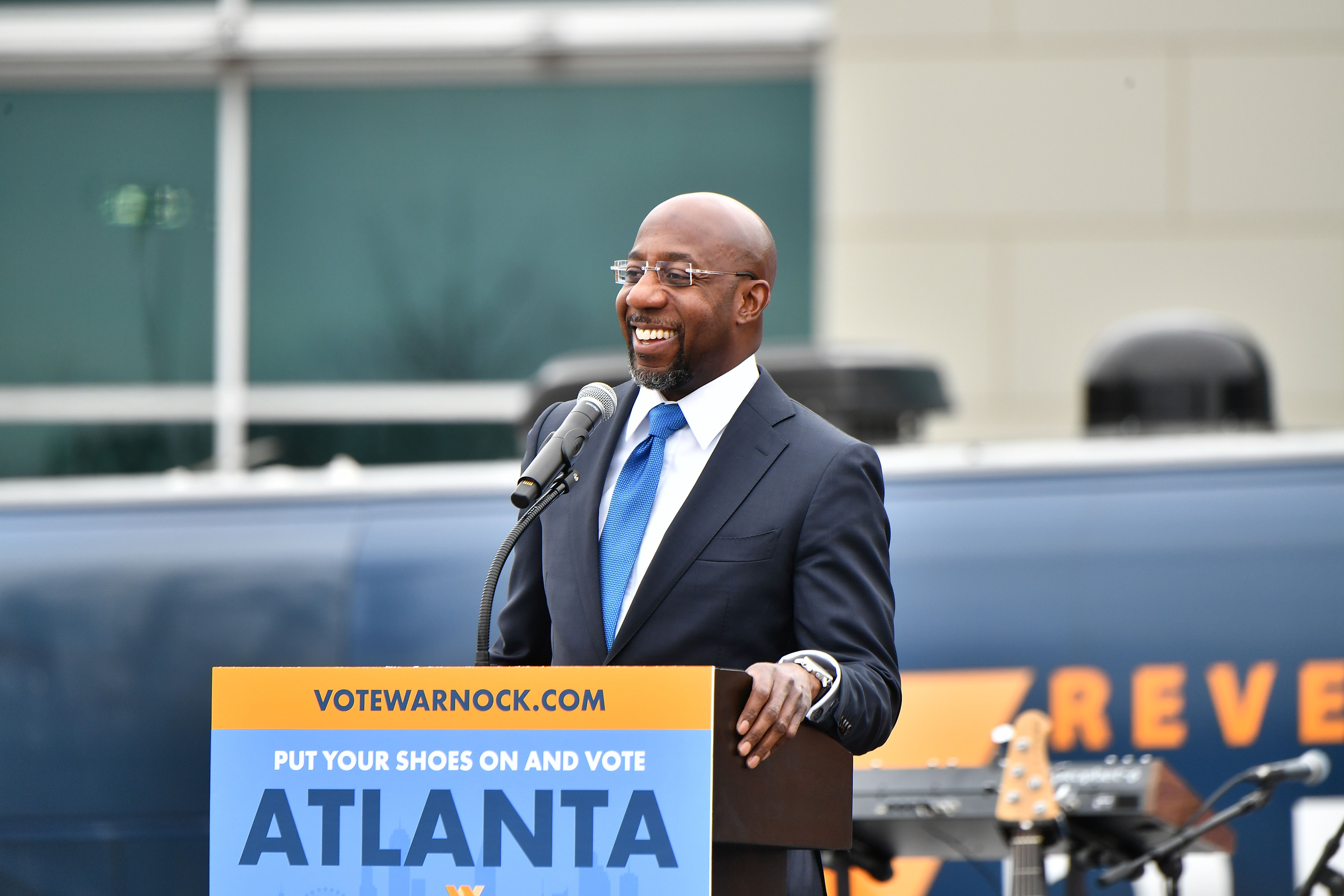 AUSTELL, GEORGIA - DECEMBER 20:  Raphael Warnock, U.S. Democratic Senate candidate, speaks during his Souls To The Polls Drive-In Rally at Riverside EpiCenter on December 20, 2020 in Austell, Georgia. (Photo by Paras Griffin/Getty Images)