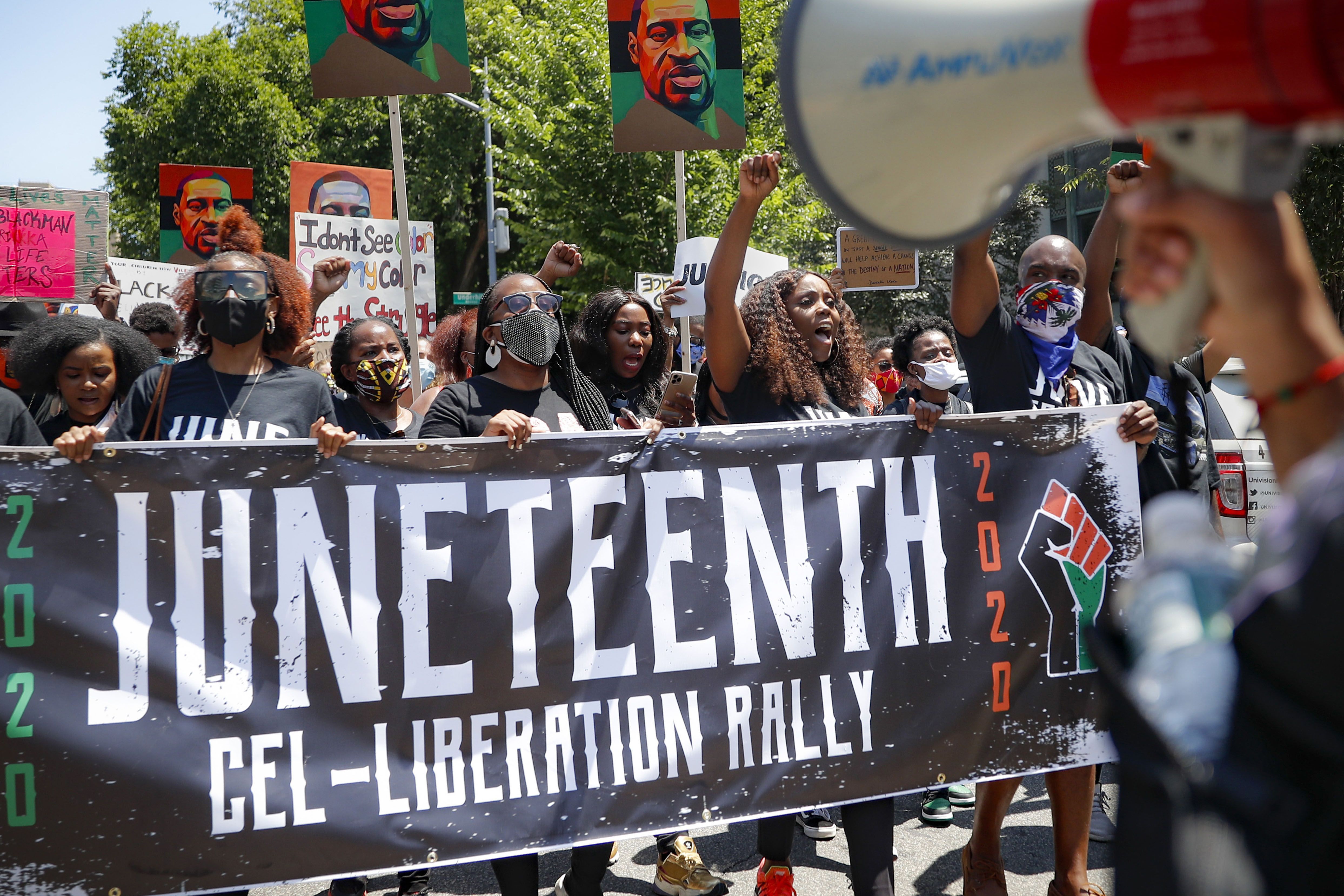 FILE- In this June 19, 2020 file photo, protesters chant as they march after a Juneteenth rally at the Brooklyn Museum, Friday, June 19, 2020, in the Brooklyn borough of New York. On Thursday, July 23, 2020, New York State passed a bill to designate June 19 as Juneteenth to commemorate the emancipation of slaves in the U.S. (AP Photo/John Minchillo, File)