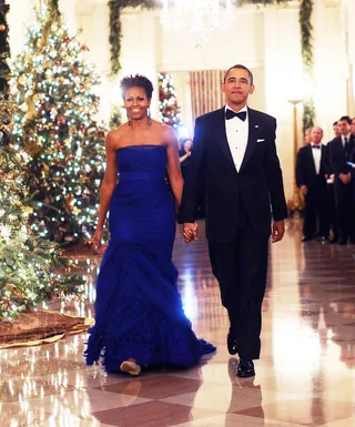 Blue Velvet - Obama was a vision in this cobalt custom Vera Wang strapless tulle gown for the Kennedy Center Honors in 2011. She accentuated her look with a braided updo and drop earrings.  (Photo: JEWEL SAMAD/AFP/Getty Images)