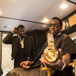 Meek Mill @meekmill - Meek helps Diddy show off his 24 karat gold headphones. Hopefully Diddy let him keep a pair!(Photo: Instagram via Meek Mill)