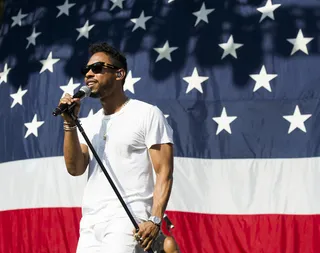 We Made It in America - Miguel performs in front of an image of the American flag during day two of the 2013 Budweiser &quot;Made in America&quot; festival in Philadelphia. (Photo: Charles Sykes/Invision/AP)