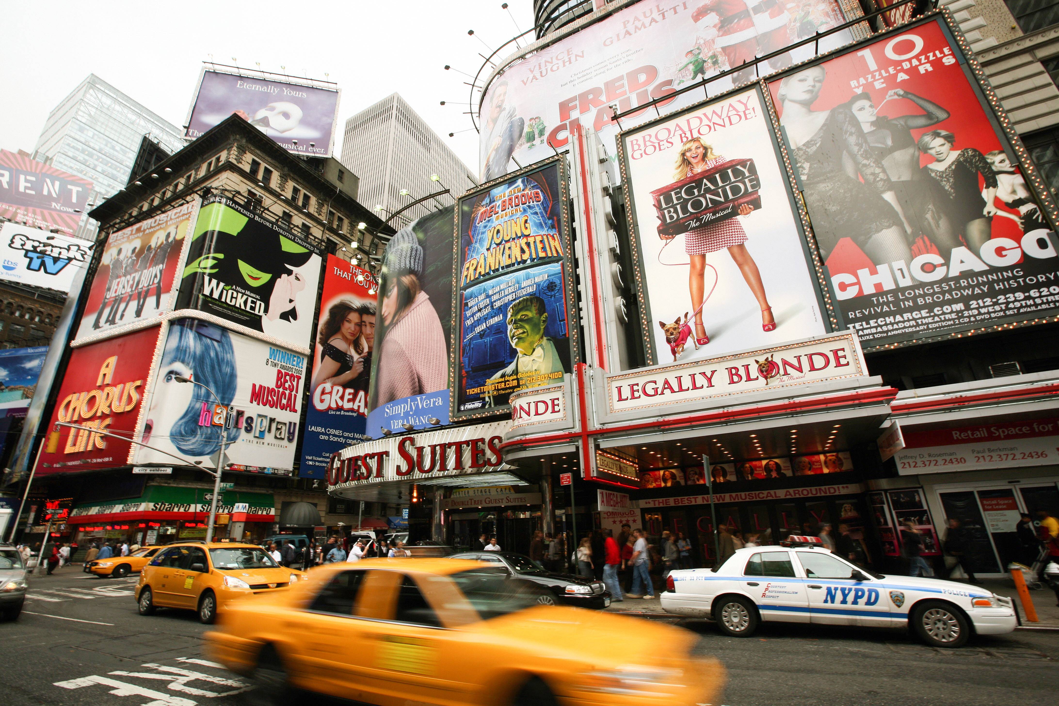 TO GO WITH AFP STORY-US-THEATRE-SOCIAL BY PAOLA MESSANA Giant billboards advertise theater and musical shows around Time Square on Broadway Avenue, the heart of the US theatre industry, in New York 10 October 2007. A wage dispute involving New York's theater producers and stagehands is threatening to bring the curtain down on dozens of Broadway shows, unless a last-minute compromise can be reached. The last such shutdown occurred in 2003, when a strike by Broadway musicians saw shows cancelled for four days. Any stoppage would cost the theaters heavily as Broadway now pumps some five billion USD into the New York economy a year, fed largely by US and foreign tourists. AFP PHOTO/Emmanuel DUNAND (Photo credit should read EMMANUEL DUNAND/AFP via Getty Images)