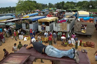 Straight From the Market - Trucks crammed with produce travel hundreds of miles from every corner of Cuba each weekday to form long lines at the 114th Street Market — a teeming open-air bazaar on Havana's outskirts that has become a key hub for getting farm products to people in the capital. — Associated Press(Photo: AP Photo/Ramon Espinosa)