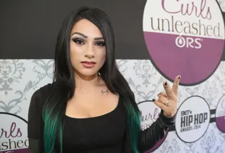 Snow Tha Product - The Cali-bred MC makes goth gorgeous with dramatic makeup and a straight black 'do dipped in emerald green. (Photo: Johnny Nunez/BET/Getty Images for BET)&nbsp;