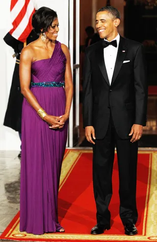 Purple Reign - The First Lady proves once again how wonderful purple looks on her with this Doo Ri Chung gown for the Korean State Dinner in 2011. The one-shoulder dress was accentuated with a crystal belt that showed off her incredible figure.  (Photo: Alex Wong/Getty Images)
