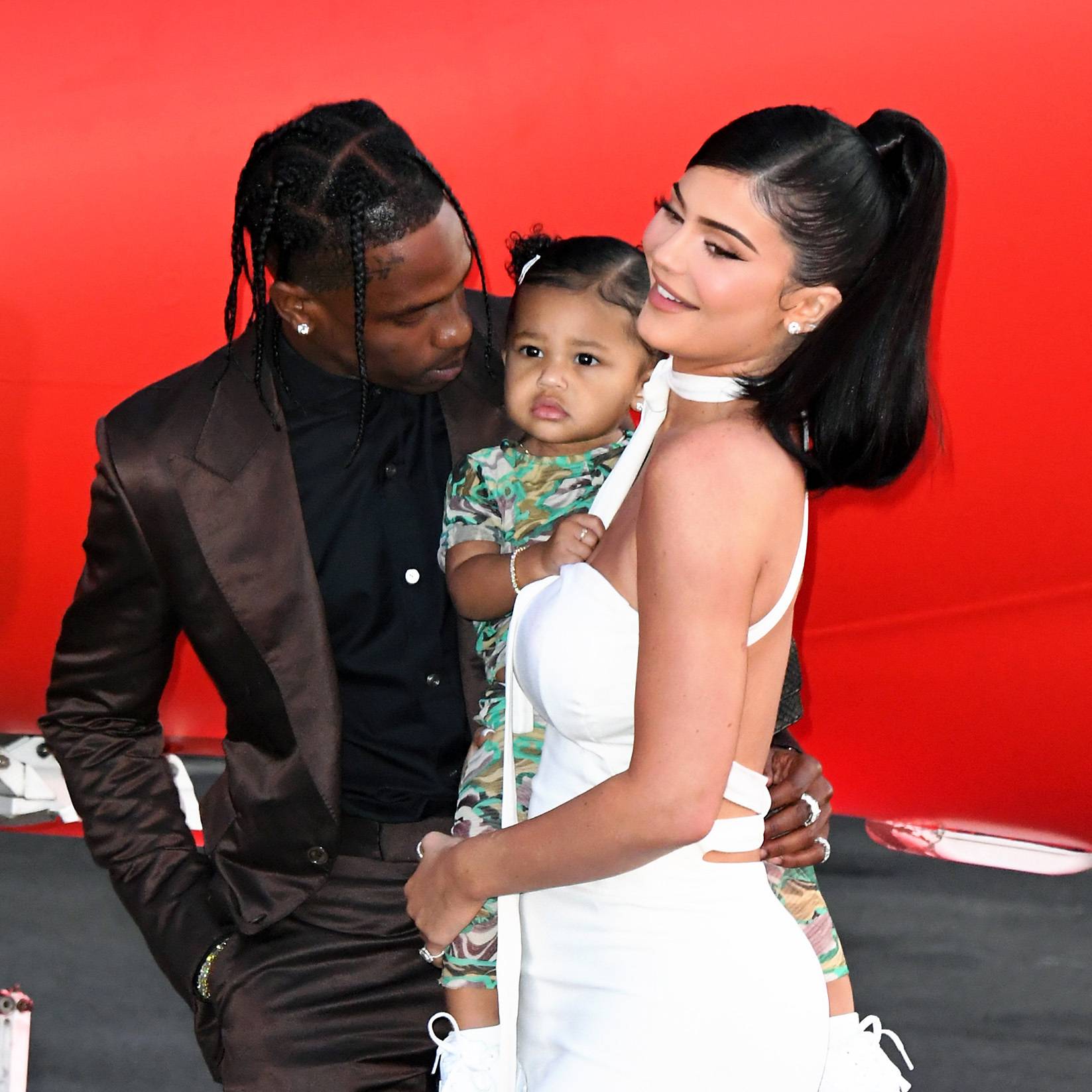 SANTA MONICA, CALIFORNIA - AUGUST 27: (L-R) Travis Scott, Stormi Webster, and Kylie Jenner attend the premiere of Netflix's "Travis Scott: Look Mom I Can Fly" at Barker Hangar on August 27, 2019 in Santa Monica, California. (Photo by Jon Kopaloff/FilmMagic)