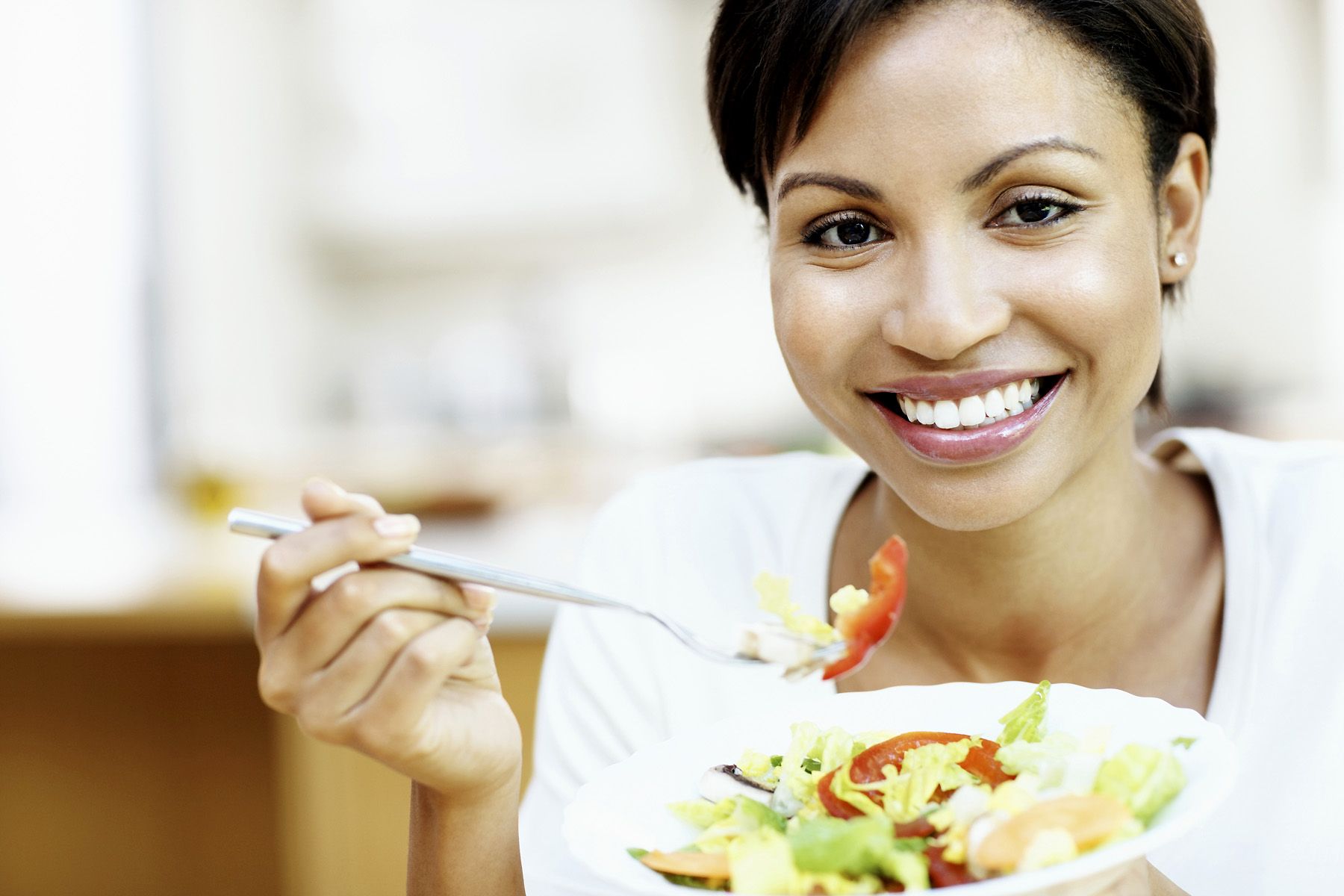 woman eating salad