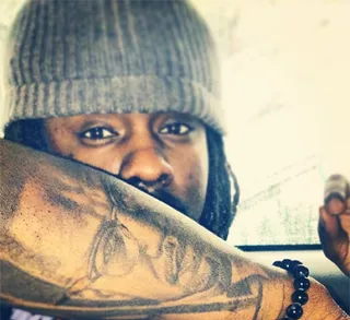 Wale @walemmg - Wale shows off his dope ink of Civil Rights activist/icon Malcolm X. (Photo: WaleMMG via Instagram)