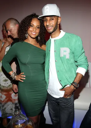 So Money\r - Newlyweds Alicia Keys and her super producer hubby Swizz Beatz strike a pose in matching money-green ensembles at the &quot;Reethym of Lite&quot; campaign unveiling at Espace in New York City. (Photo by Jerritt Clark/Getty Images)