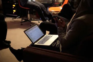 Mac-ing - Kanye busy at work on his computer.&nbsp;(Photo: Courtesy of Life + Times)