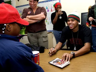 Taking It Home - Chris never forgot where he came from and gave back to the community that raised him at the Tappahanock Children's Center during a toy drive.(Photo: Tommy Gravad/WENN.com)