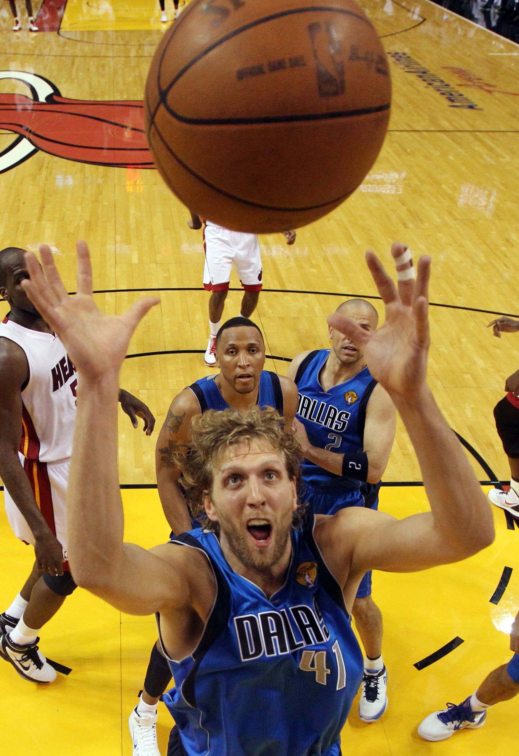 Working Hard - Dirk Nowitzki goes up for a rebound.(Photo: AP Photo/Ronald Martinez; Pool)
