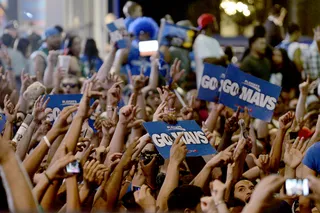 Fans Go Wild - Mavericks fans celebrate their team's NBA championship win over the Miami Heat at Victory Plaza in Dallas.(Photo: AP Photo/Matt Strasen)