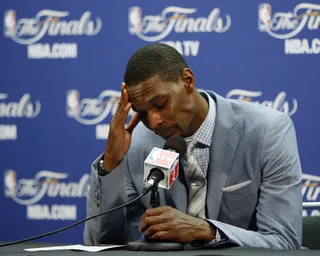 A Sad Day - An unhappy Chris Bosh holds his head down.(Photo: AP Photo/Wilfredo Lee)