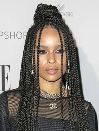Zoë Kravitz - Top knots are still a fall favorite. Zoë&nbsp;rocks a half-up/half-down braided style at the&nbsp;2014&nbsp;Elle Style Awards in Sydney.&nbsp; (Photo: Australscope, PacificCoastNews)
