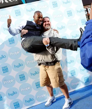 Hey, Hot Stuff! - Model Tyson Beckford gets lifted off his feet onstage at the&nbsp;People Celebrates Iconic "Sexiest Man Alive" Issue in Times Square in New York City.&nbsp;(Photo: Cindy Ord/Getty Images for People)