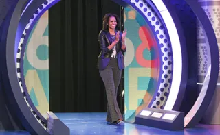 She Moves - First Lady Michelle Obama glides her way across the 106 stage to be interviewed.(Photo: Bennett Raglin/BET/Getty Images for BET)