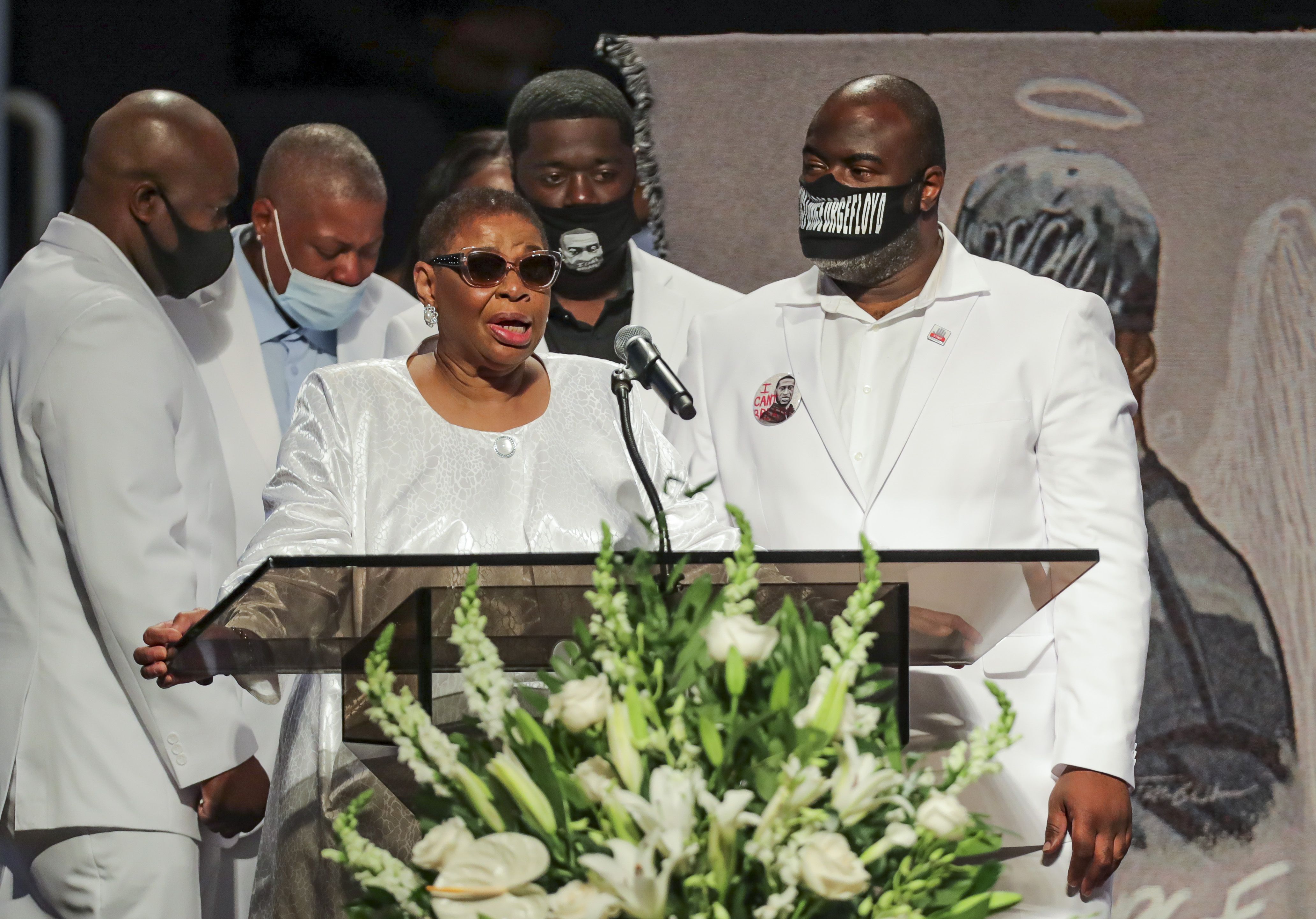The family of of George Floyd comes to the podium to speak during the funeral for George Floyd on Tuesday, June 9, 2020, at The Fountain of Praise church in Houston. Floyd died after being restrained by Minneapolis Police officers on May 25. - George Floyd will be laid to rest Tuesday in his Houston hometown, the culmination of a long farewell to the 46-year-old African American whose death in custody ignited global protests against police brutality and racism.Thousands of well-wishers filed past Floyd's coffin in a public viewing a day earlier, as a court set bail at $1 million for the white officer charged with his murder last month in Minneapolis. (Photo by Godofredo A. VASQUEZ / POOL / AFP) (Photo by GODOFREDO A. VASQUEZ/POOL/AFP via Getty Images)