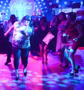 Thanks to Coca-Cola!  - The BET Experience Latin Showcase Presented by Coca-Cola featured a lavender-lit dance floor against the backdrop of a live band and DJ on the 1's and 2's.   (Photo: Jason Kempin/Getty Images for BET)