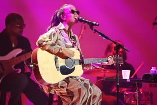 A Girl With Her Guitar And Ponytail