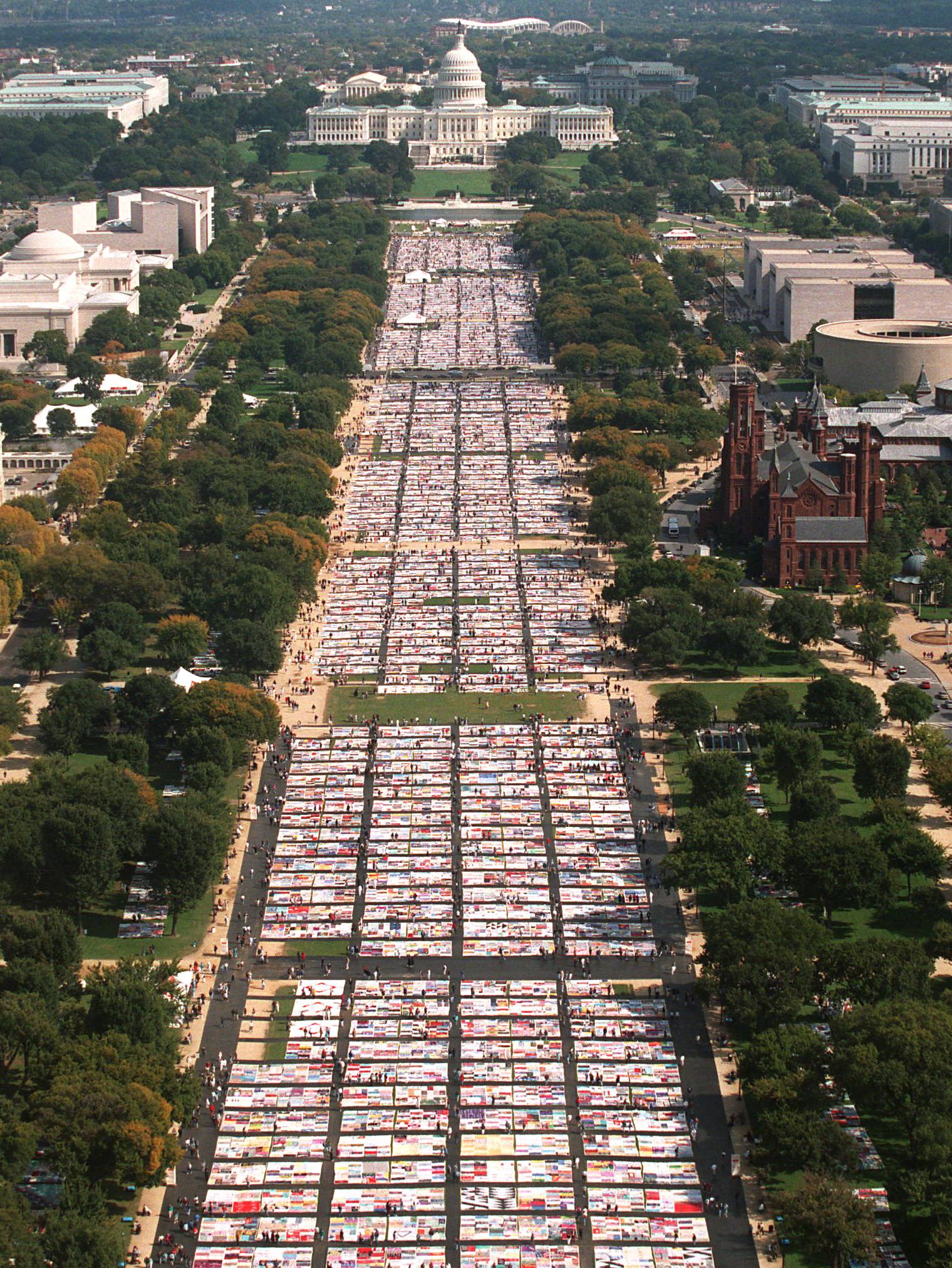 Impressive Dedication - Sections of the quilt are often displayed in various cities around the world, but to view it in its entirety, it would take over 33 days if you spent just one minute gazing at each panel. Here, a photo of the quilt stretched out across the National Mall in Washington, D.C., when the panels numbered just near 40,000.(Photo: Chuck Kennedy/MCT/Landov)