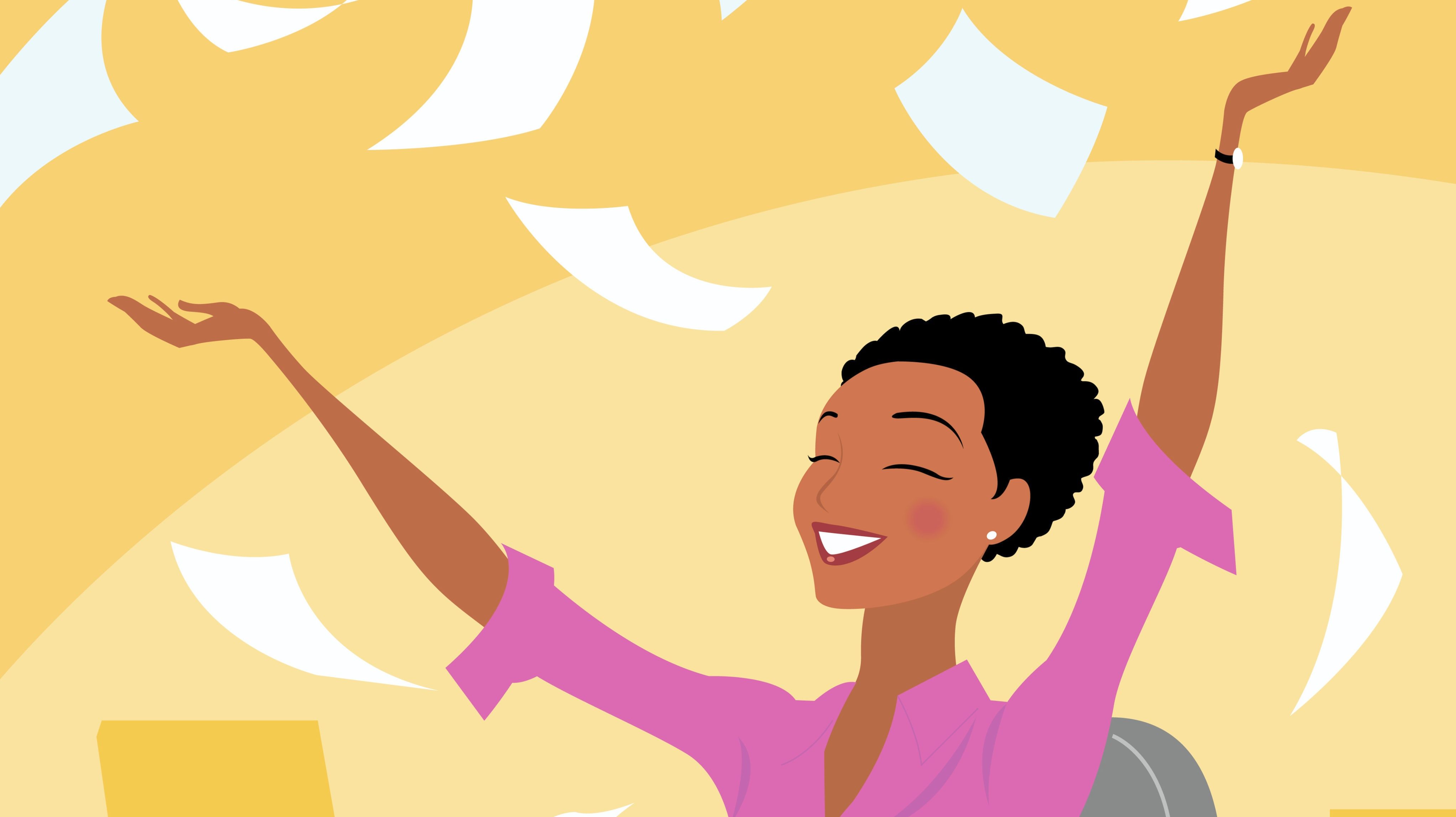 Businesswoman at her desk throwing papers into the air in triumph.