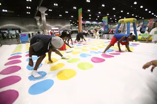 A Family Affair - The Twister challenge was just one of the many family-friendly activities during fan fest.&nbsp;(Photo: Tommaso Boddi/Getty Images for BET)