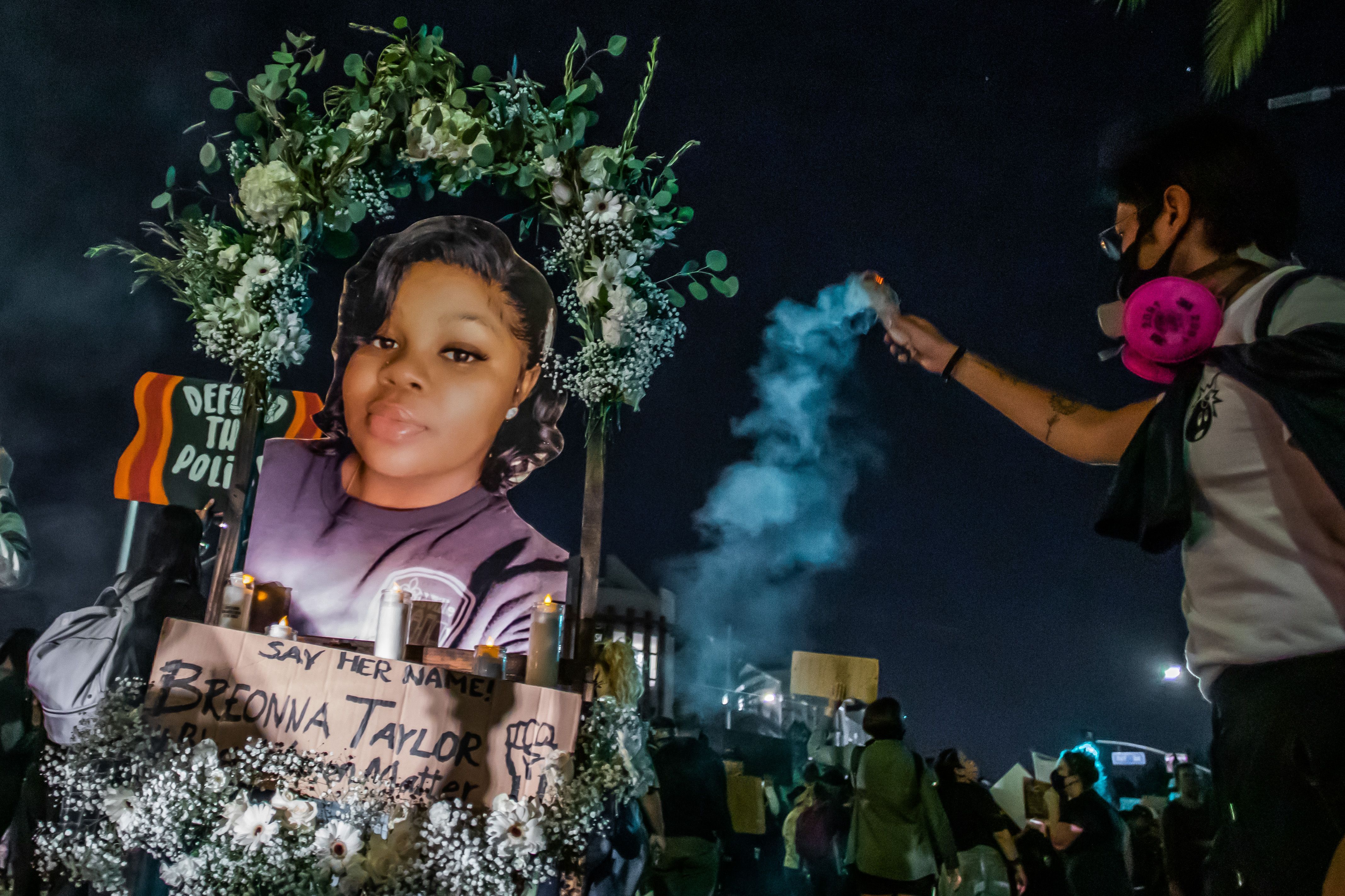 Protesters march against police brutality in Los Angeles, on September 23, 2020, following a decision on the Breonna Taylor case in Louisville, Kentucky. - A judge announced charges brought by a grand jury against Detective Brett Hankison, one of three police officers involved in the fatal shooting of Taylor in March. Hankison was charged with three counts of "wanton endangerment" in connection with the shooting. (Photo by Apu GOMES / AFP) (Photo by APU GOMES/AFP via Getty Images)