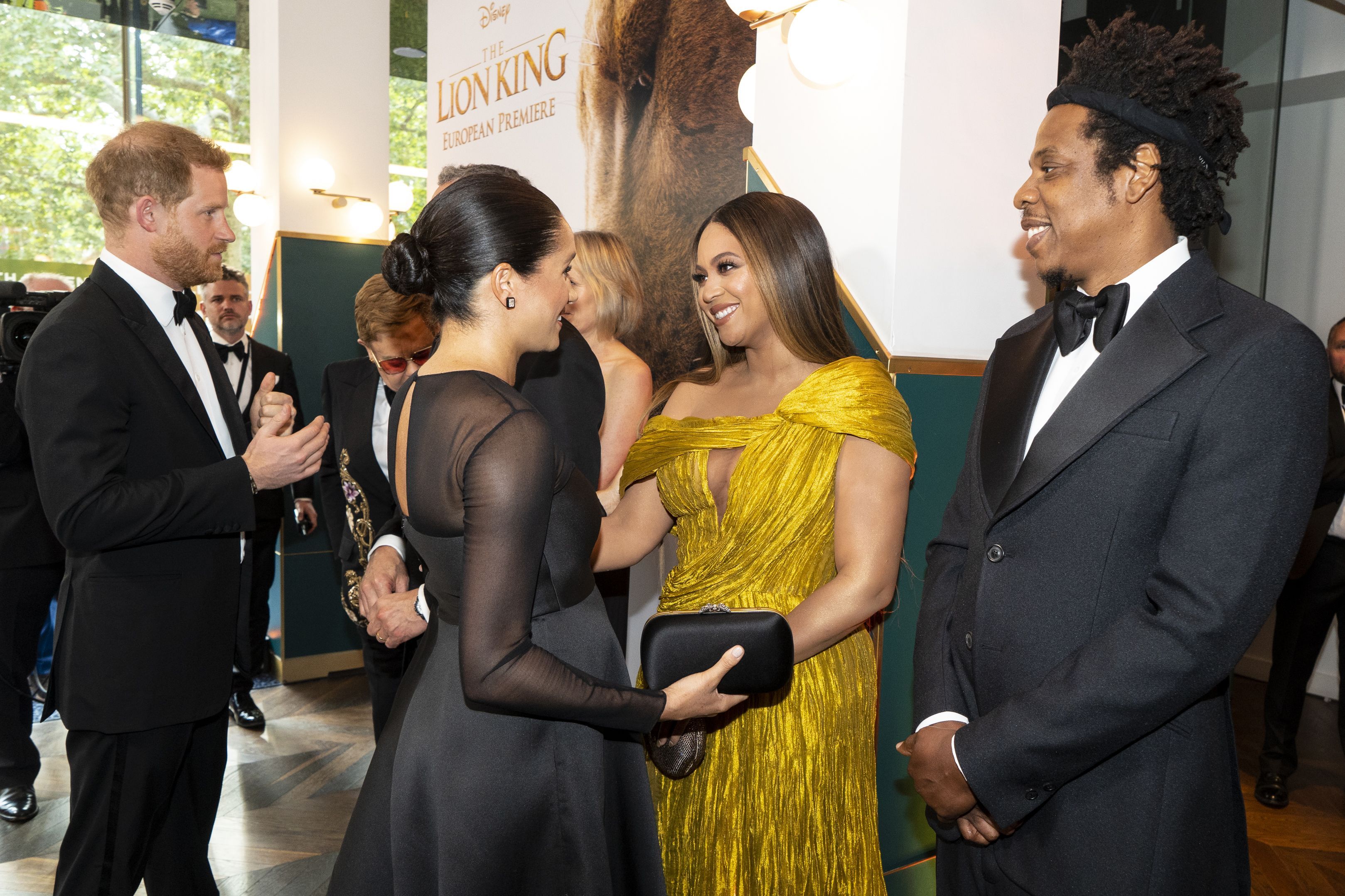 TOPSHOT - Britain's Prince Harry, Duke of Sussex (L) and Britain's Meghan, Duchess of Sussex (2nd L) meets cast and crew, including US singer-songwriter BeyoncÃ© (C) and her husband, US rapper Jay-Z (R) as they attend the European premiere of the film The Lion King in London on July 14, 2019. (Photo by Niklas HALLE'N / POOL / AFP) (Photo by NIKLAS HALLE'N/POOL/AFP via Getty Images)