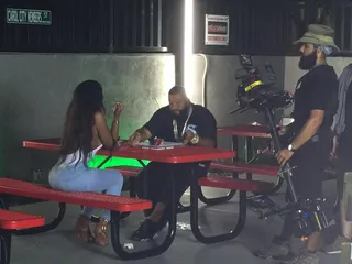 Chill Time - Khaled takes a much-needed break with a female friend between takes.  (Photo: Jerry Bagley)