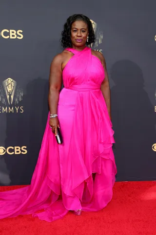 Uzo Aduba - Uzo Aduba is pretty in a bright oink Christian Siriano gown.&nbsp; (Photo by Rich Fury/Getty Images)