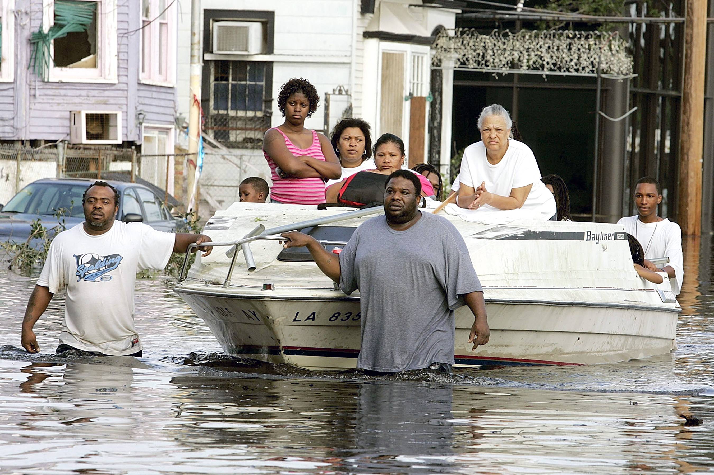 The Hurricane That Changed Everything - Upon the 10th anniversary of Hurricane Katrina, BET.com takes a look back at scenes from the aftermath of the natural disaster. You can watch BET's news special Katrina 10 Years Later: Through Hell in High Water here.  In this photo, people on Canal Street use a boat to get to higher ground as water began to fill the streets. Thousands of people were left homeless after the hurricane.&nbsp;(Photo: Mark Wilson/Getty Images)